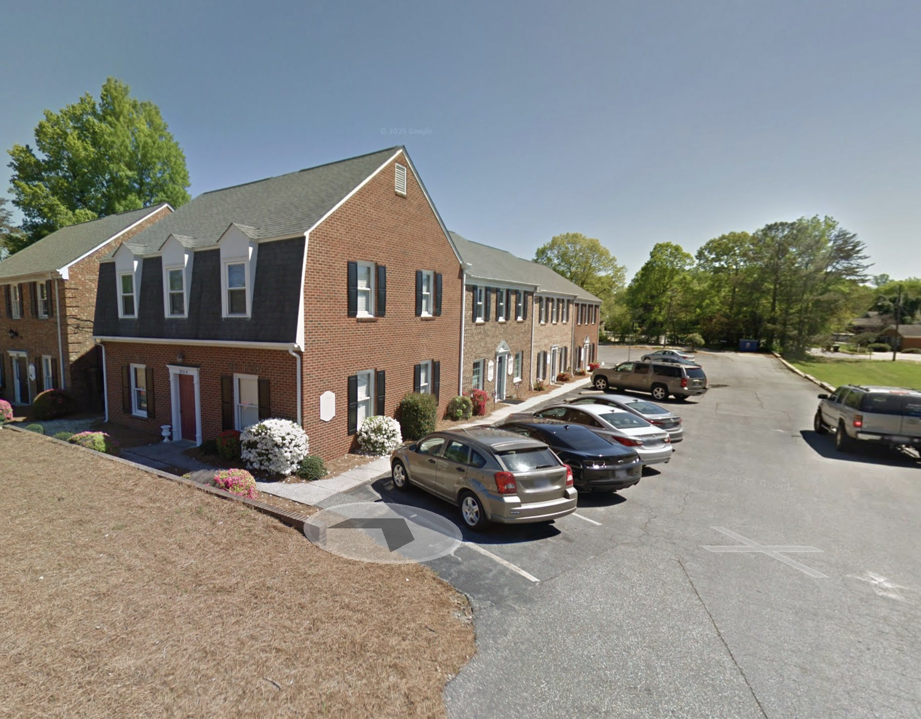 Exterior of the Shade Tree Counseling office building and parking area